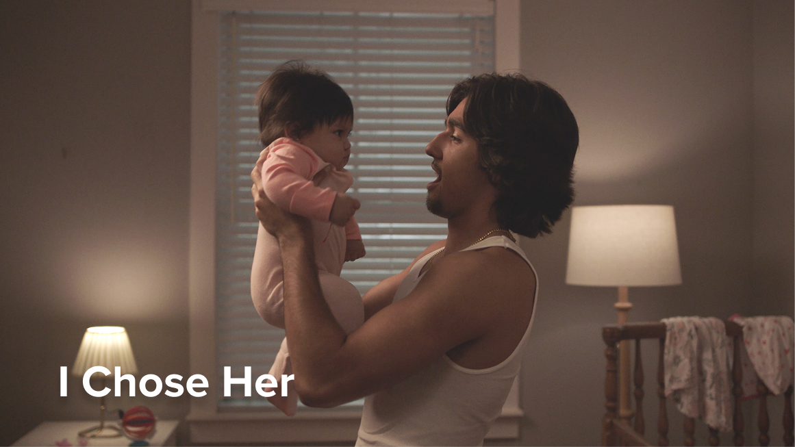 Young dad holding baby girl